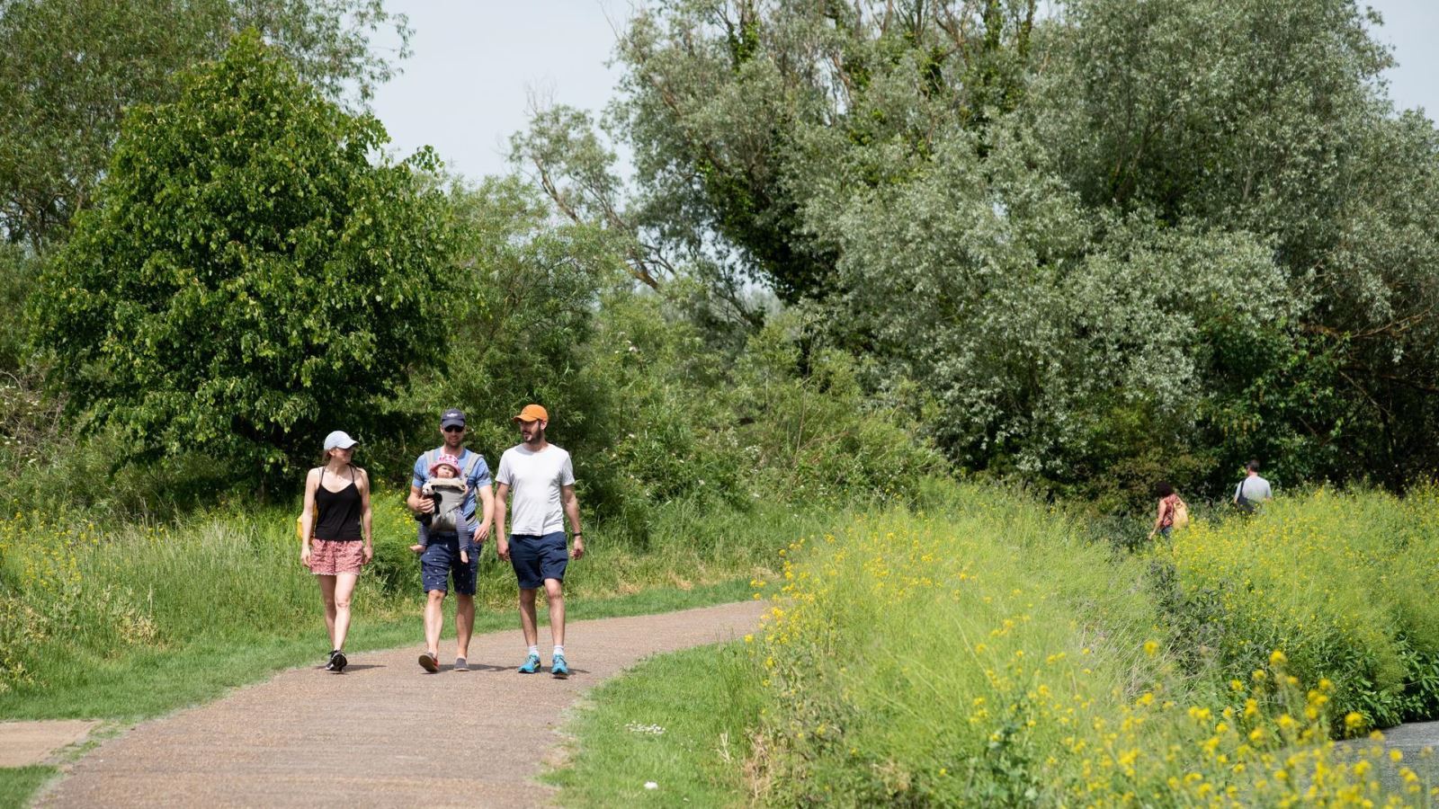 Three People Walking Through Lee Valley Regional Park